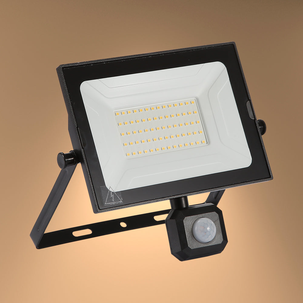 A sleek, black outdoor LED floodlight with a built-in motion sensor. A modern lighting solution for your home or business.