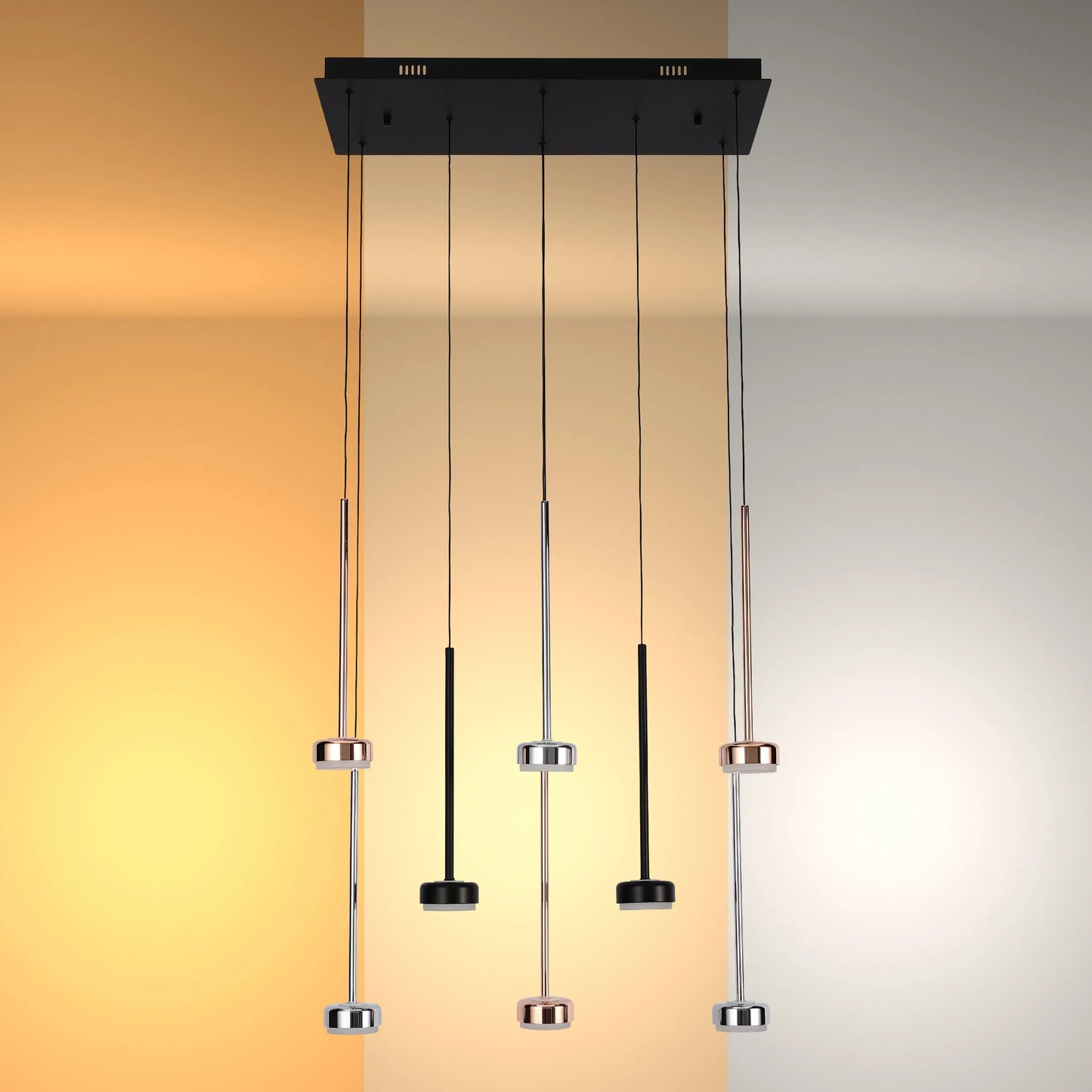 Modern multi-pendant light fixture with chrome and black accents, suspended from a rectangular black ceiling mount.