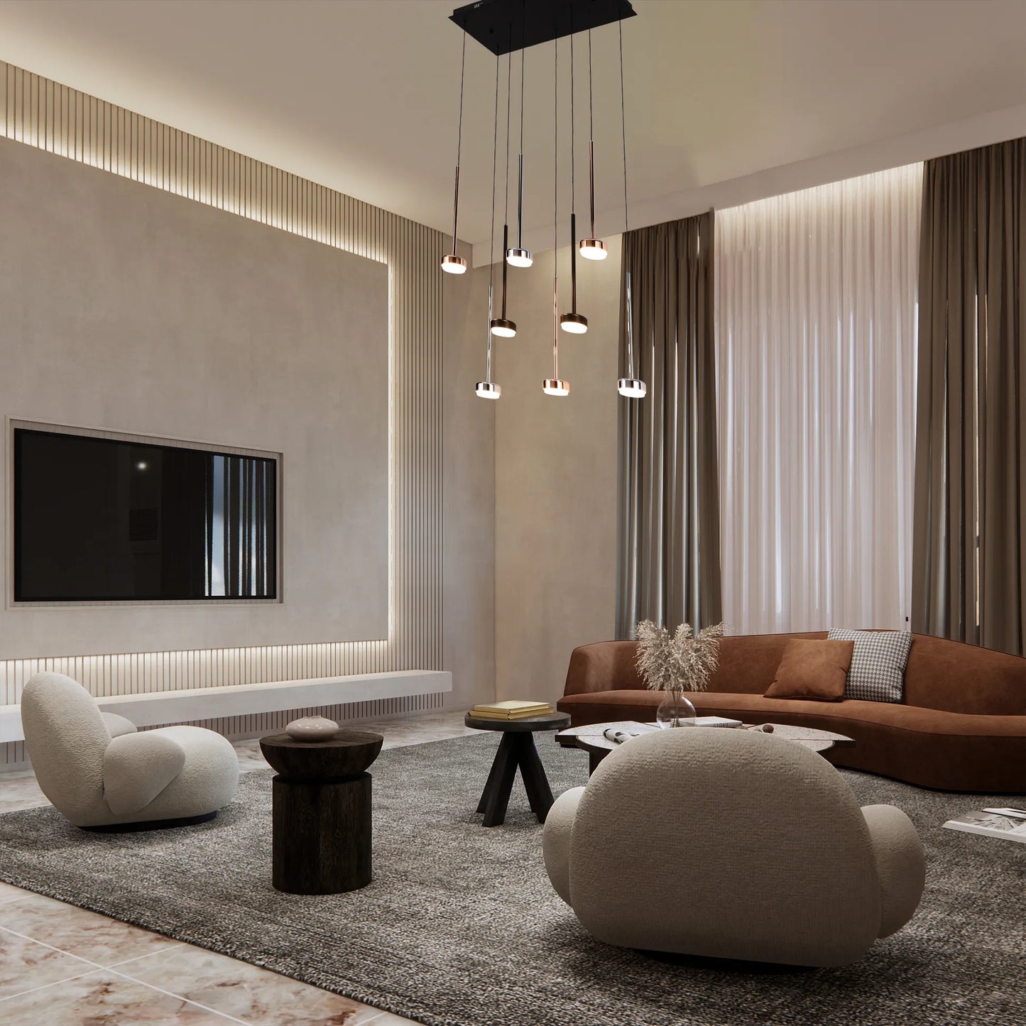 Living room with modern multi-pendant light fixture, casting a warm glow. Ambient lighting enhances the contemporary design.