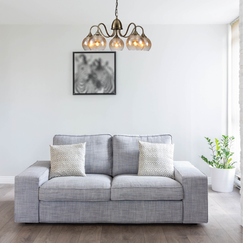 Living room lighted with amber dome glass globe antique brass swan chandelier ceiling light