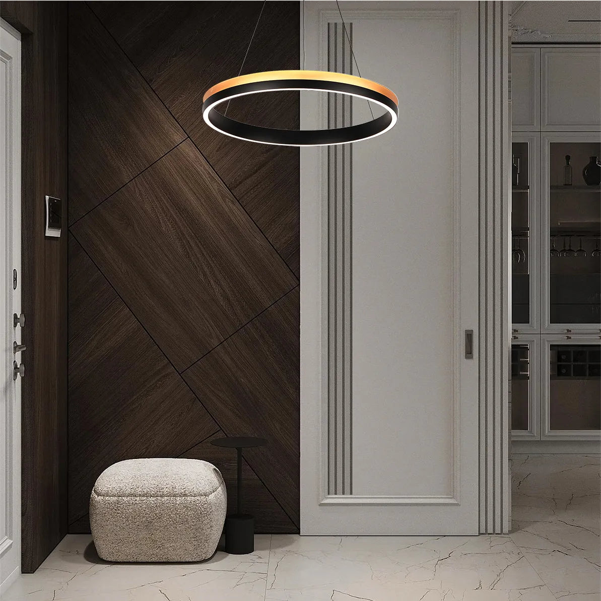 A modern circular LED pendant light with a black and gold finish hangs in a stylish entryway.