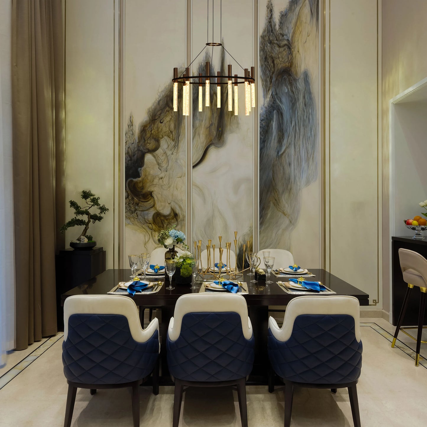 Modern dining room featuring a statement ring chandelier with vertical light bars, creating a warm and inviting ambience.