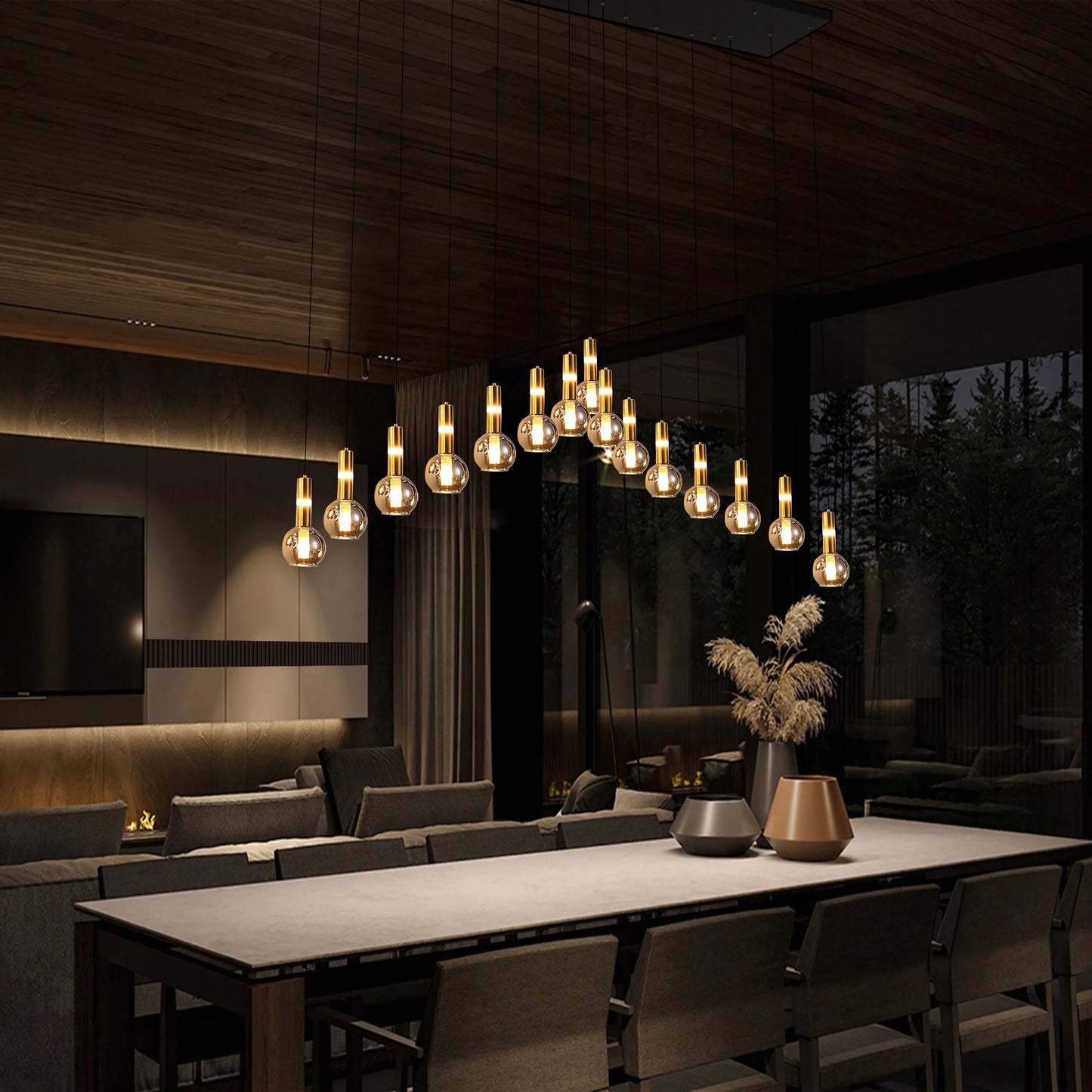 Contemporary pendant lighting with glass and gold accents, hanging above a dining table. Modern and luxurious interior design.