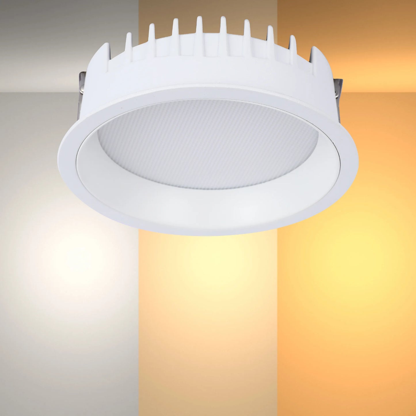 A white, round LED downlight with a ridged heat sink, set against a colour gradient showcasing different colour temperatures.