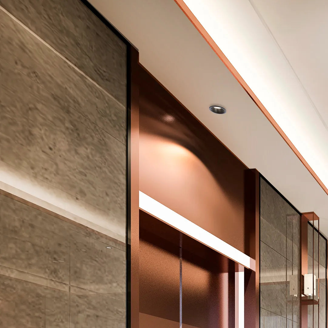 Contemporary ceiling lights illuminate a modern interior with sleek, built-in fixtures and a warm, inviting glow.
