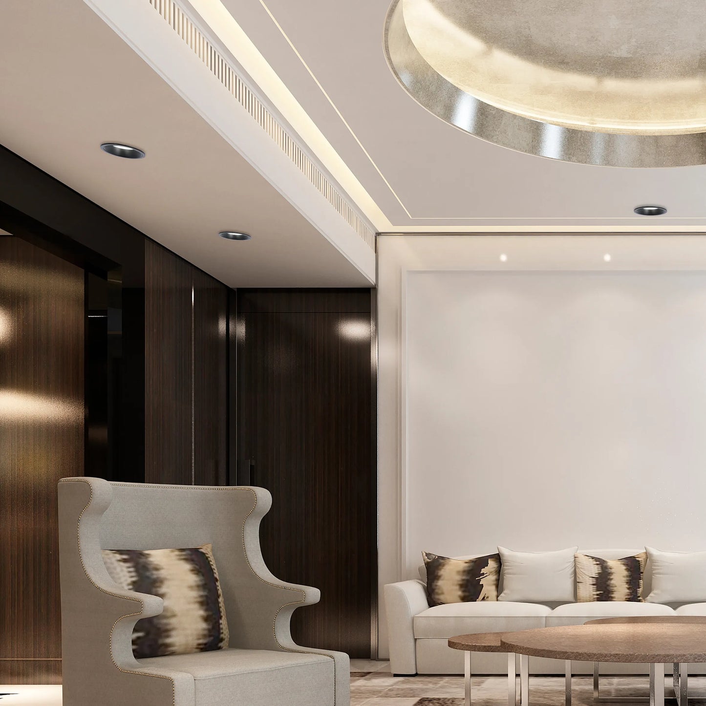 The room features recessed downlights and concealed strip lighting, plus a striking circular ceiling light, creating a warm, layered ambience.