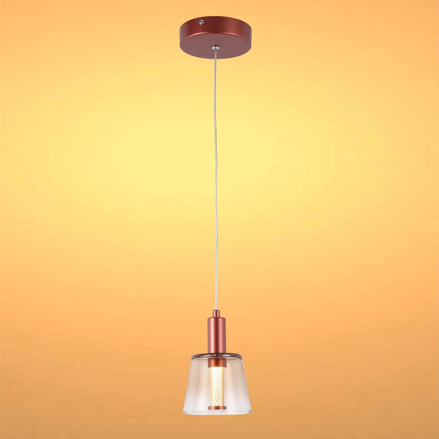 Contemporary copper-finish pendant light with glass shade. A stylish and modern lighting fixture for any room.
