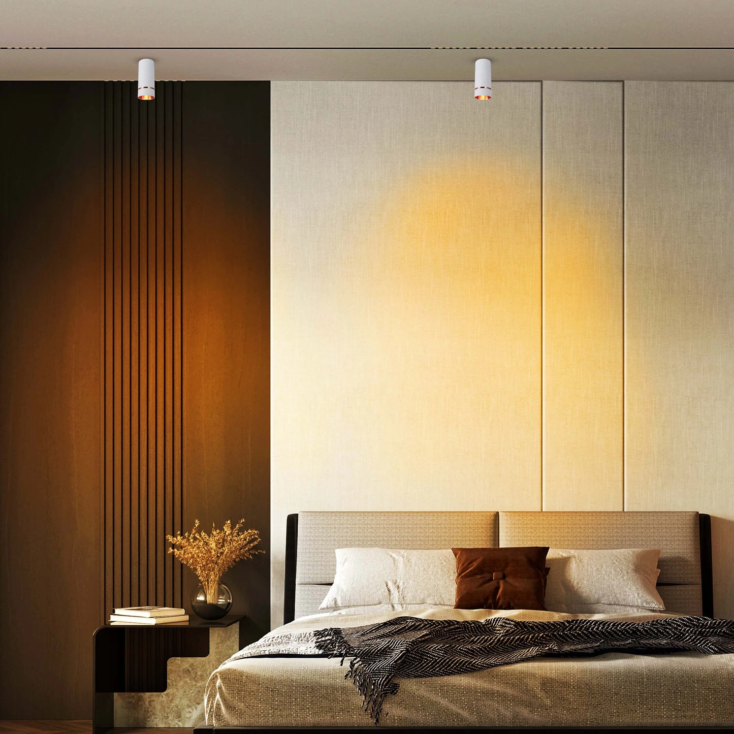 Modern bedroom lighting featuring two sleek, ceiling-mounted spotlights casting a warm glow. Perfect for creating ambience.