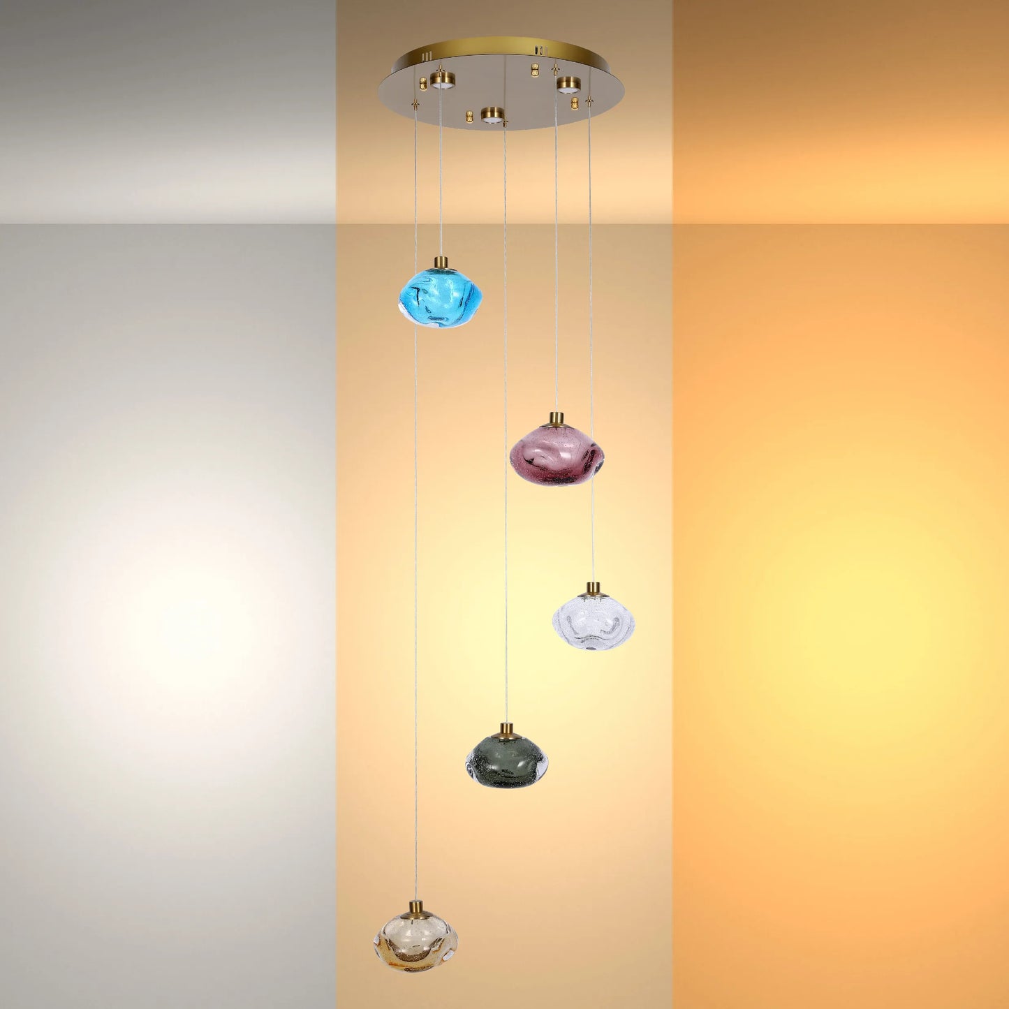 Modern pendant light with various coloured glass orbs hanging from a gold ceiling rose, adding a stylish and contemporary touch to any room.