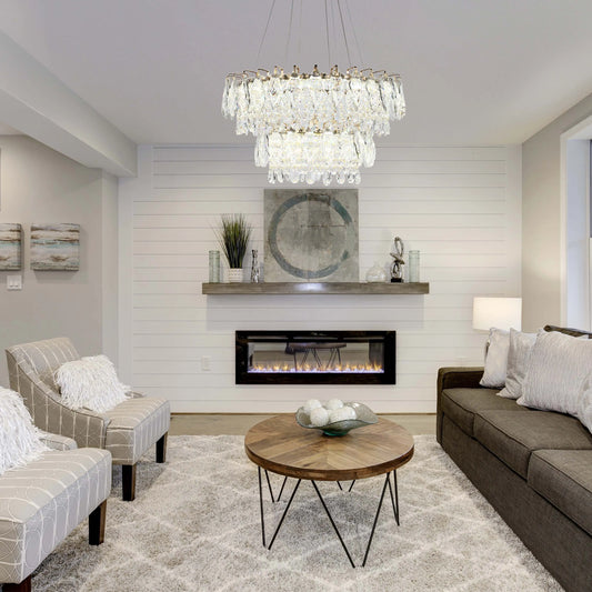 A multi-tiered crystal chandelier provides the focal point in this bright living room, creating a luxurious ambience.