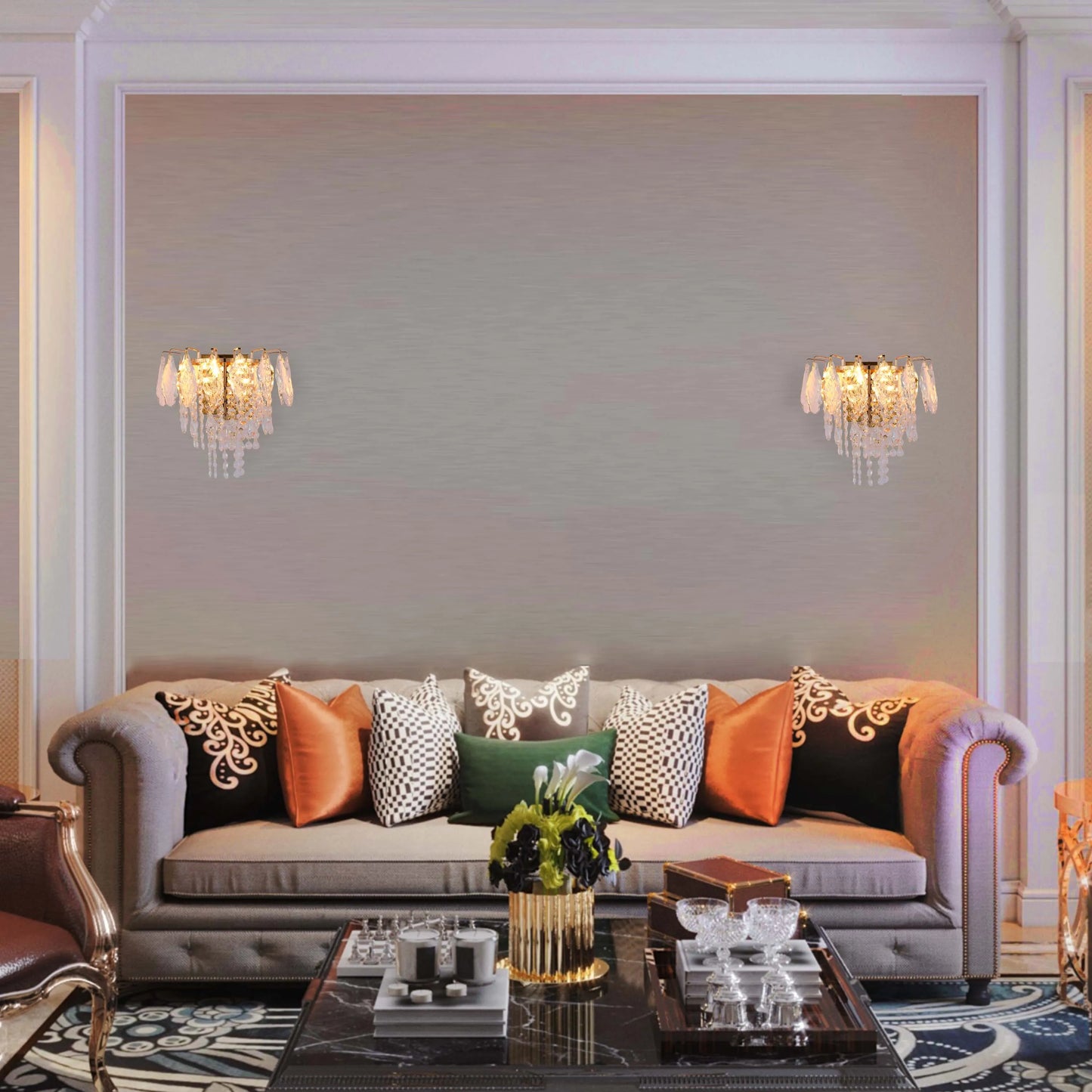 Elegant wall sconces adorn a stylish living room. The fixtures feature crystals that add a touch of glamour and sophistication.