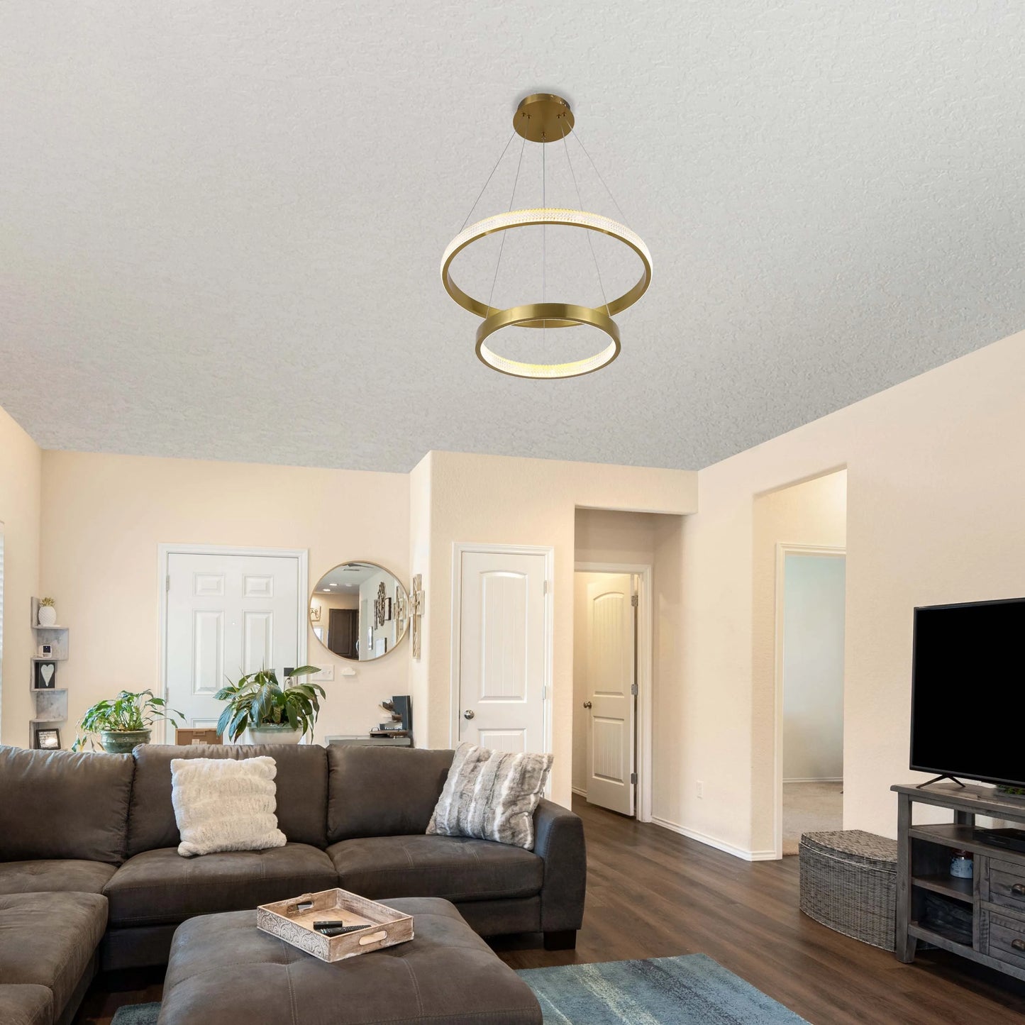 Modern two-ring chandelier in gold. Adds a stylish, contemporary feel to the living room.