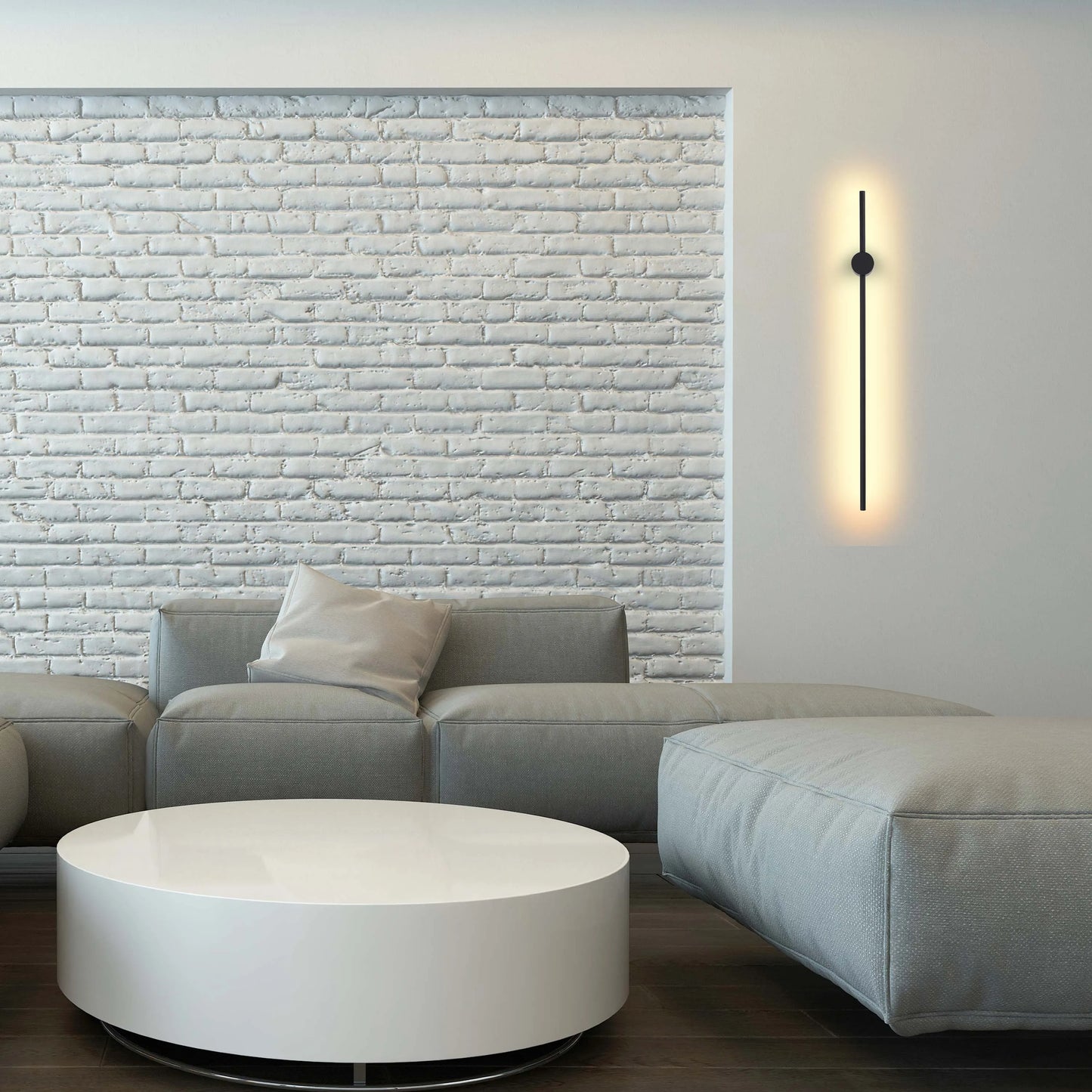 A modern LED wall light casts a warm glow on a neutral wall, complementing the minimalist interior design.