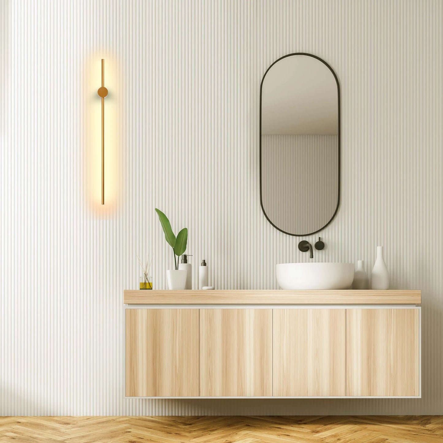 Vertical light with a round accent providing a gentle glow on a textured bathroom wall.
