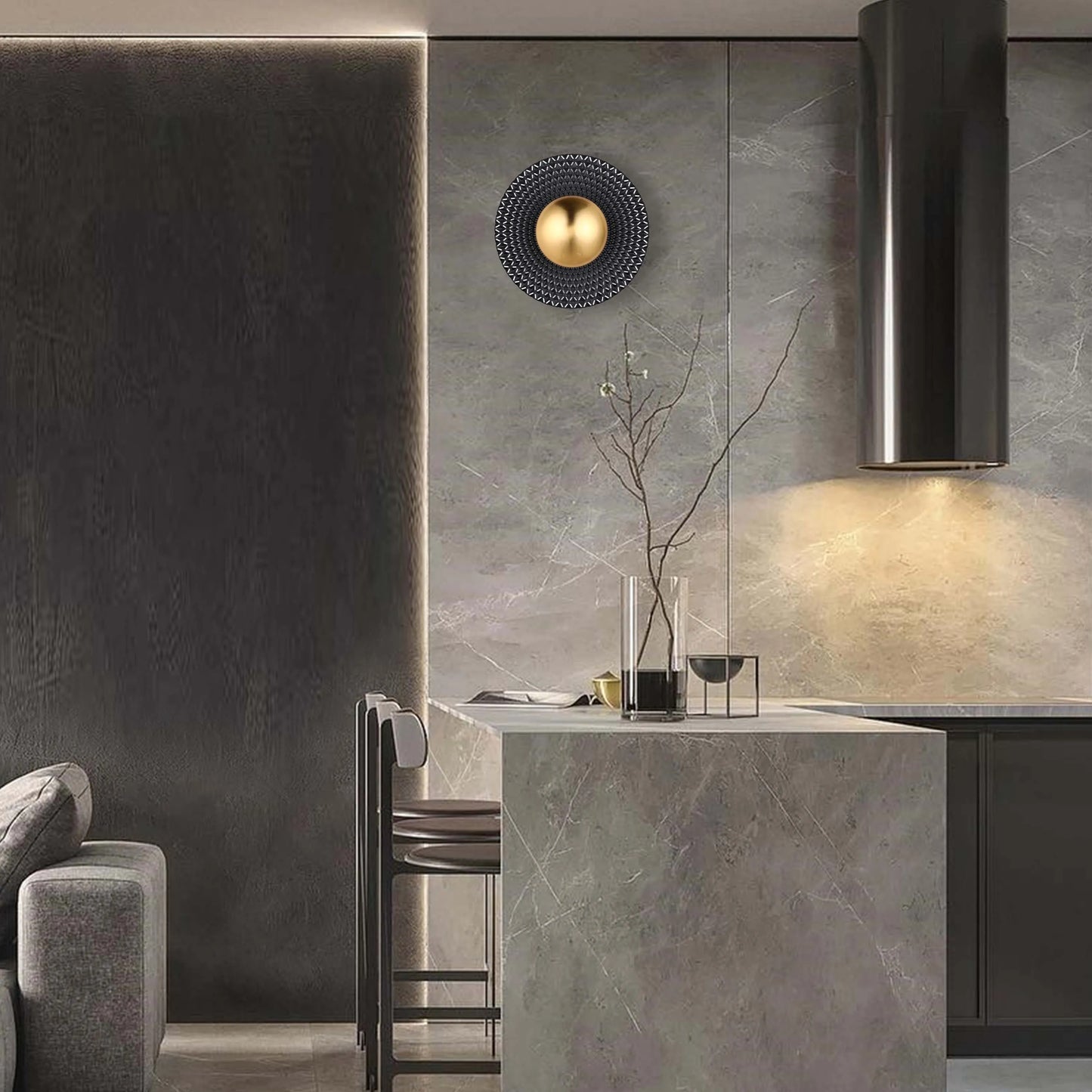 Contemporary lighting on display: a spherical, gold wall light alongside sleek, integrated ceiling lights create a modern ambiance.