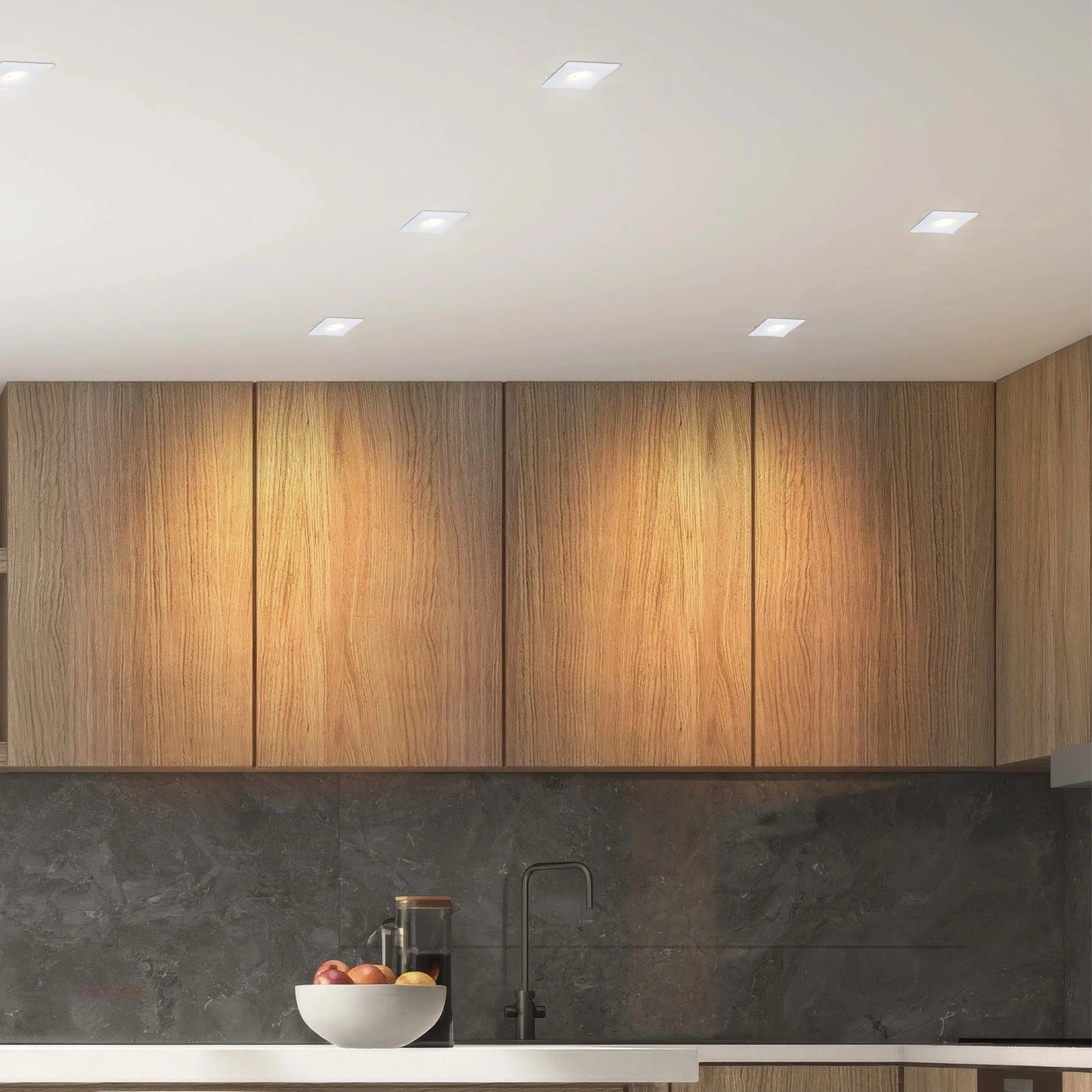 Modern kitchen lighting featuring recessed square downlights providing bright, ambient light, complementing the sleek, contemporary design.