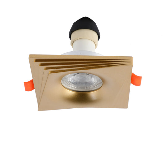 Square gold downlight with layered design and LED bulb. Sleek and modern recessed lighting for a contemporary space.