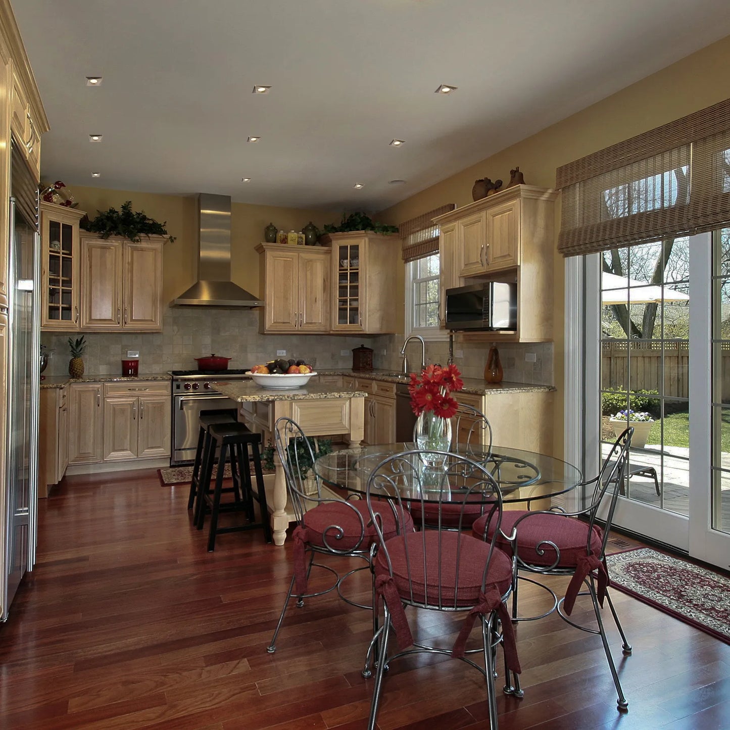 The kitchen features recessed downlights, providing bright and even illumination across the space.