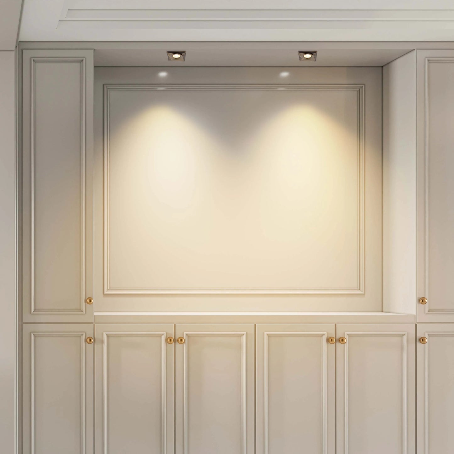 Built-in wall unit featuring spotlights, creating warm, inviting illumination on display and cupboard space.