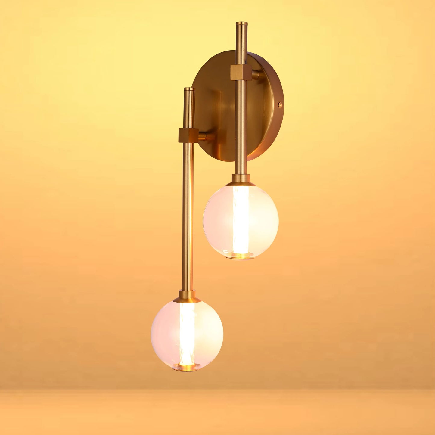 Stylish two-bulb wall light with glass spheres and a gold metal fitting. Adds a touch of glamour to any room.