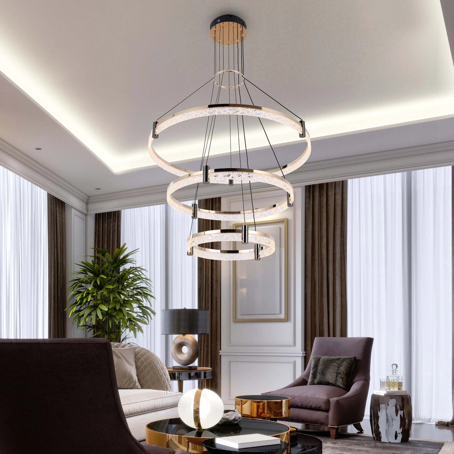 A three-tiered, circular crystal chandelier in a modern living room setting, providing ambient and decorative lighting.