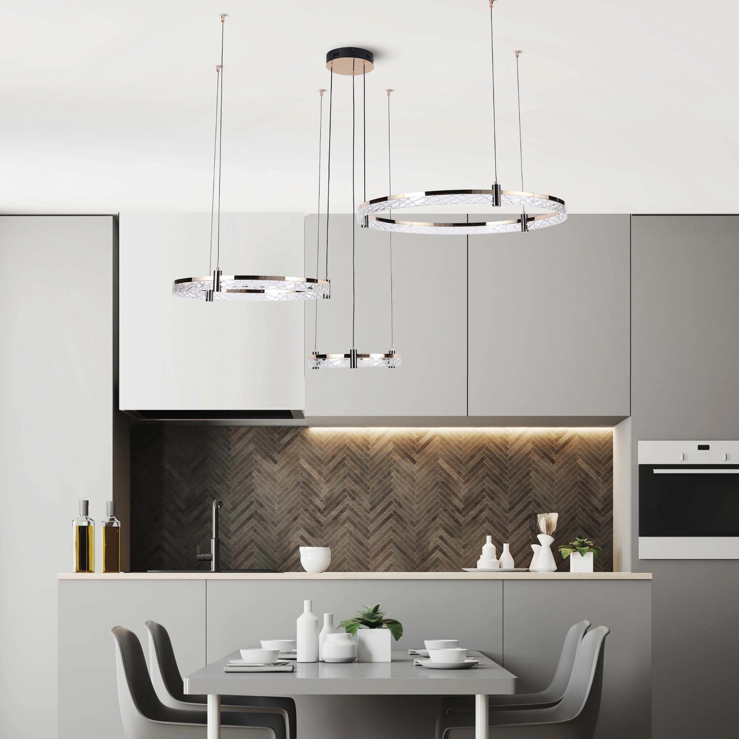 A stylish kitchen showcases modern ring chandeliers with crystal details, providing bright and elegant illumination.