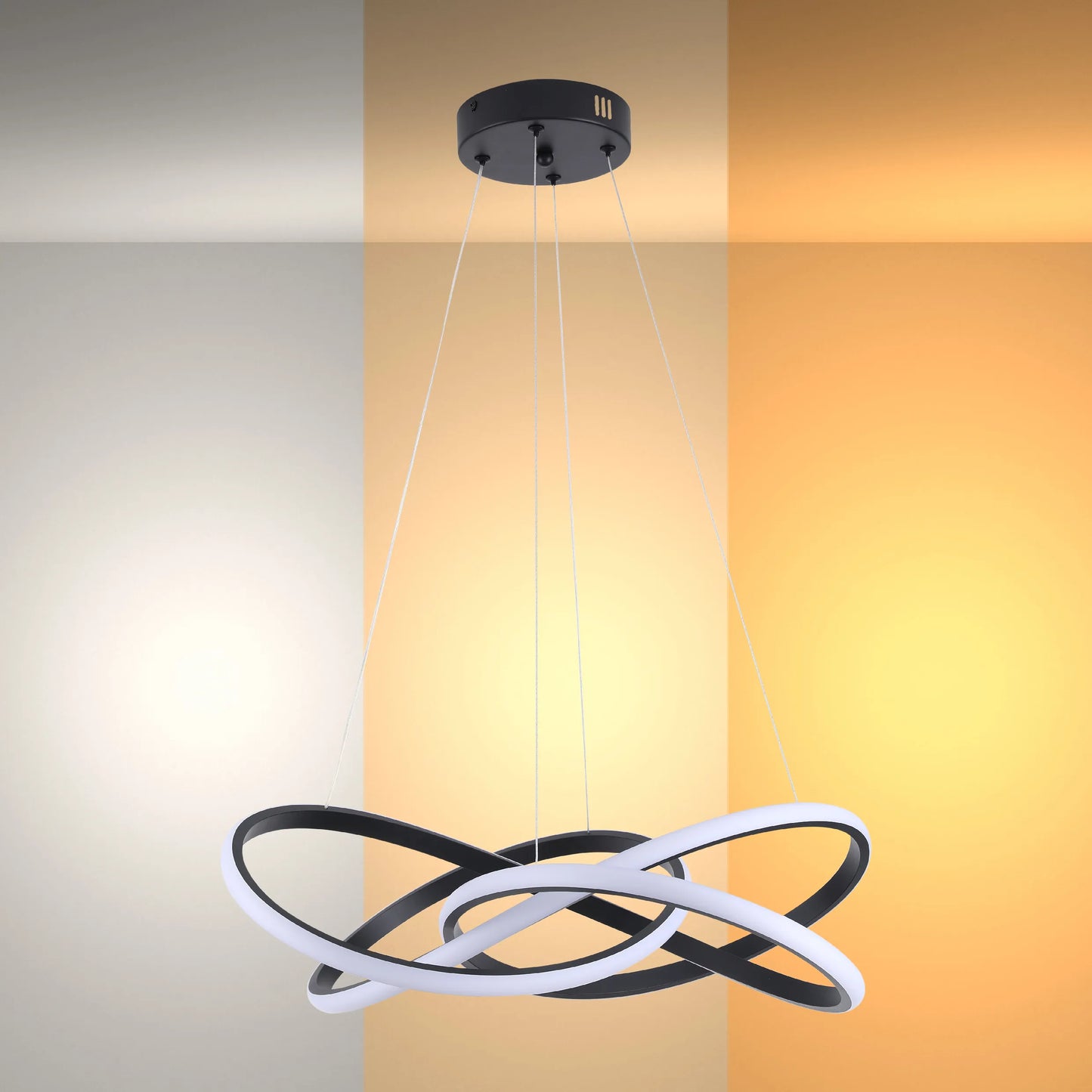 Contemporary black and white LED pendant light with intertwined rings, suspended from the ceiling by thin wires.