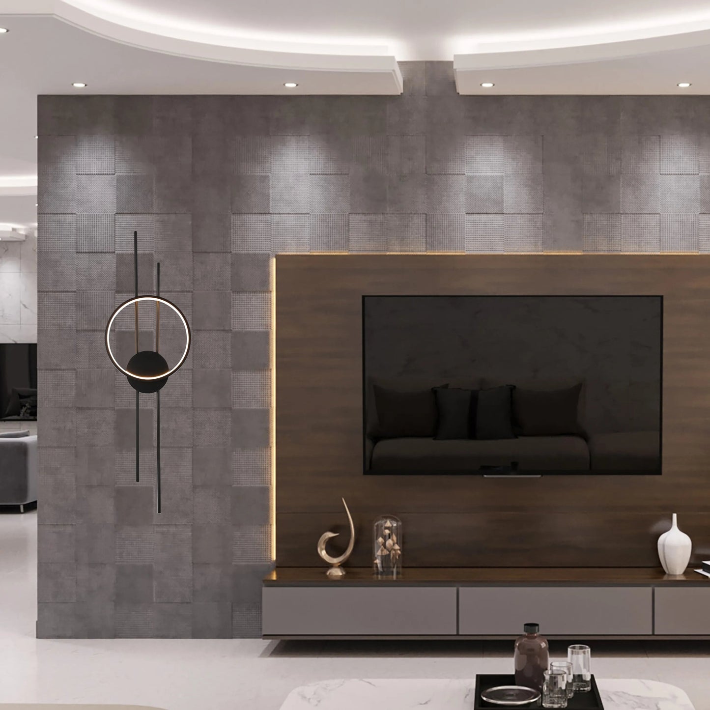 Modern lighting scheme with recessed ceiling lights and a striking feature wall sconce, complemented by subtle TV backlighting.