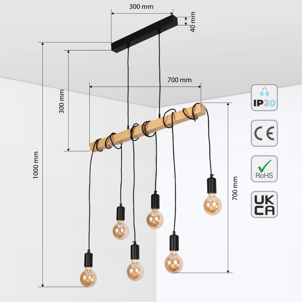 Industrial pendant light with five exposed bulbs hanging from a wooden beam, suspended by black cables.