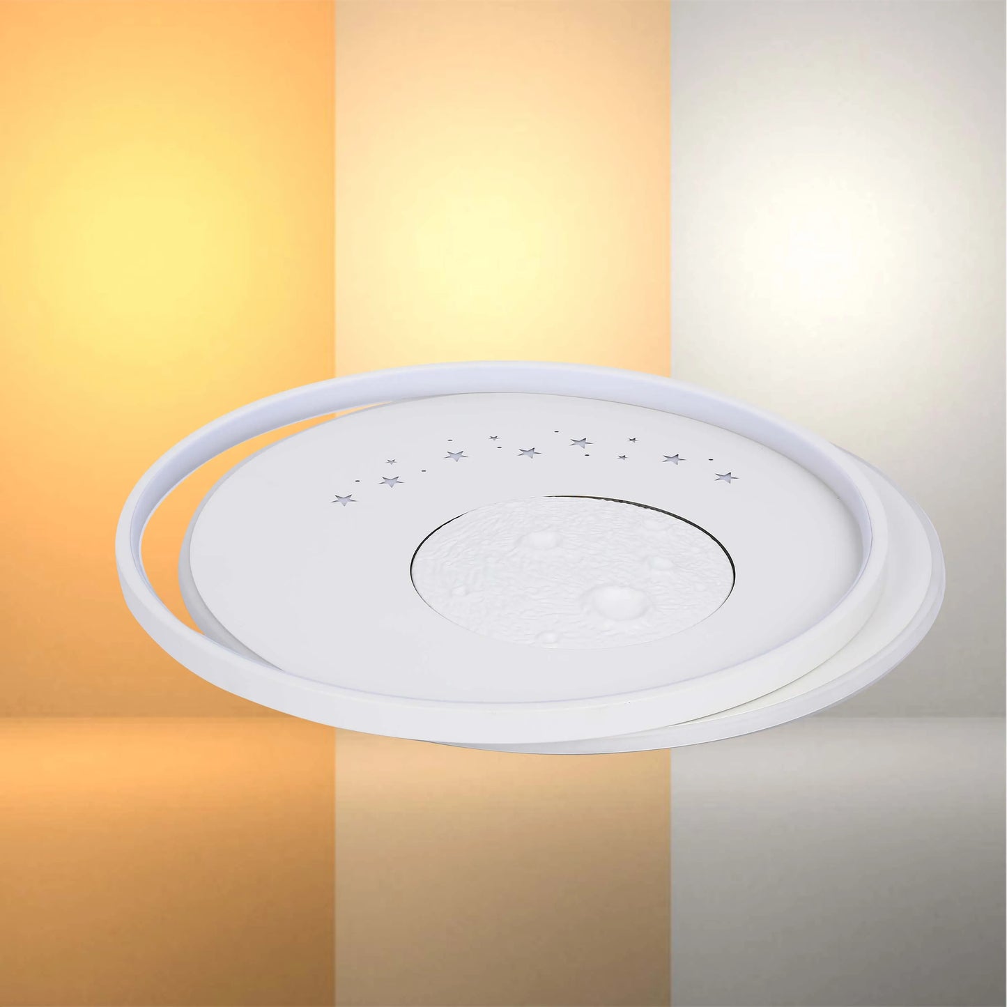 A ceiling light fixture with a moon and stars pattern, set against a vertically split background of warm and cool light tones.