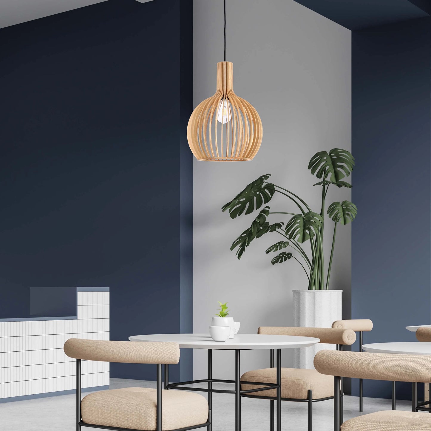 A stylish, wooden pendant light hanging above round tables and chairs in a modern cafe. The light's warm glow complements the neutral decor.