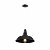 A black metal pendant light with a lampshade and Edison-style bulb, suspended from the ceiling by a thin cord.