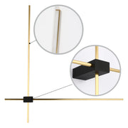 A sleek, minimalist wall light with a gold finish and a black central fixture. A modern lighting solution.