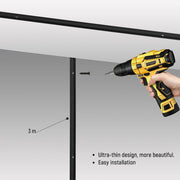 Contemporary LED lighting being installed with a power drill in a light grey room. Good lighting.