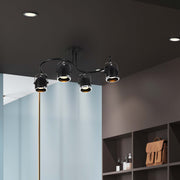 in a dark room S shape Rotatable GU10 Spotlight Black and Chrome 4 lamp used for accent lighting