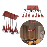 Stylish pendant lighting with conical shades in a warm red hue. Contemporary design, ideal for dining room or living space enhancement.
