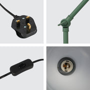 Close-up of a green lamp's components: a UK plug, adjustable joint, inline switch, and E27 lamp holder.