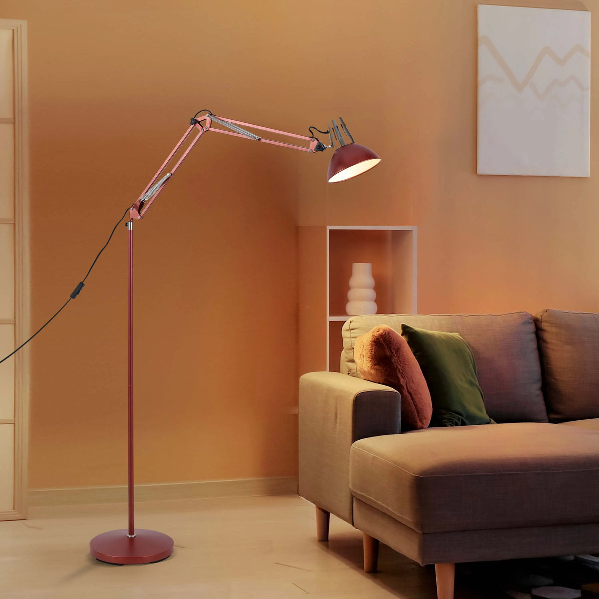 A warm, inviting living room illuminated by an adjustable rose-coloured floor lamp, casting a gentle glow across the space.