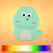 Soft, diffused lighting illuminates a cute, cartoonish dinosaur-shaped night light, creating a warm and inviting glow.