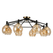 Modern Sputnik-style ceiling light with amber glass shades and a black and brass finish.
