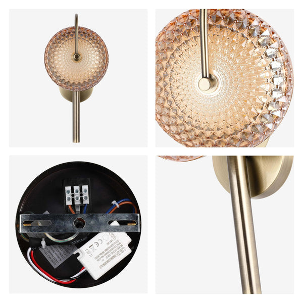 A stylish wall light with an amber-tinted, textured glass shade and antique brass finish. Perfect for adding warmth to any room.