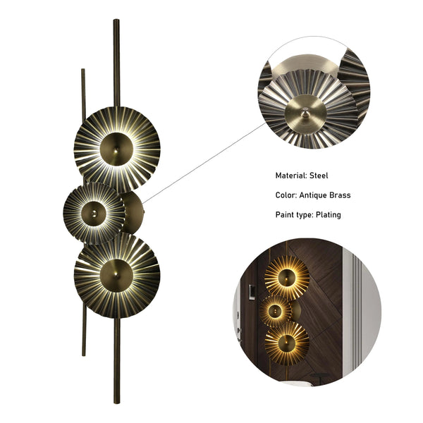 An antique brass, steel wall light with unique sunburst shades and warm, diffused lighting.