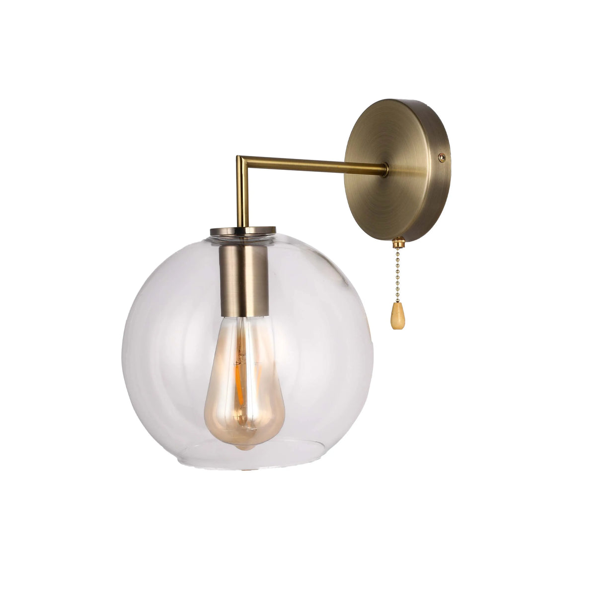 Vintage-style wall light with a spherical glass shade and aged brass fitting, complete with a traditional pull cord.