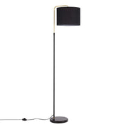 A modern floor lamp with a black shade, sleek black stand and a gold accent for an elegant touch.