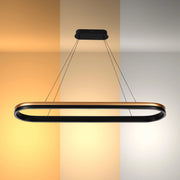 A black and bronze LED pendant light illuminating three different warm white hues.