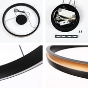 A sleek, circular LED ceiling light with a black outer ring and a warm, golden interior, offering adjustable colour temperature.
