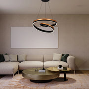 Modern, spiral LED pendant light in bronze and black. Statement lighting for a contemporary living space.