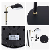 Sand black and antique brass floor lamp with a domed head and adjustable arm. Parts laid out for assembly.