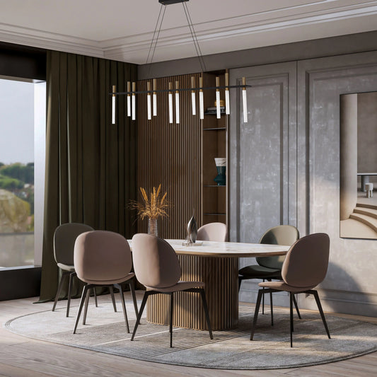 Contemporary dining room lighting featuring a linear chandelier with glass rods and gold accents above a dining table with seating.