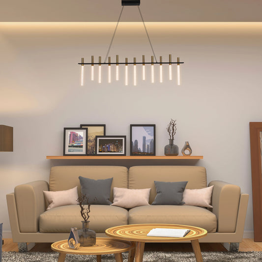 Contemporary interior lighting. A linear chandelier with gold and translucent glass tubes hangs above a neutral-toned sofa.